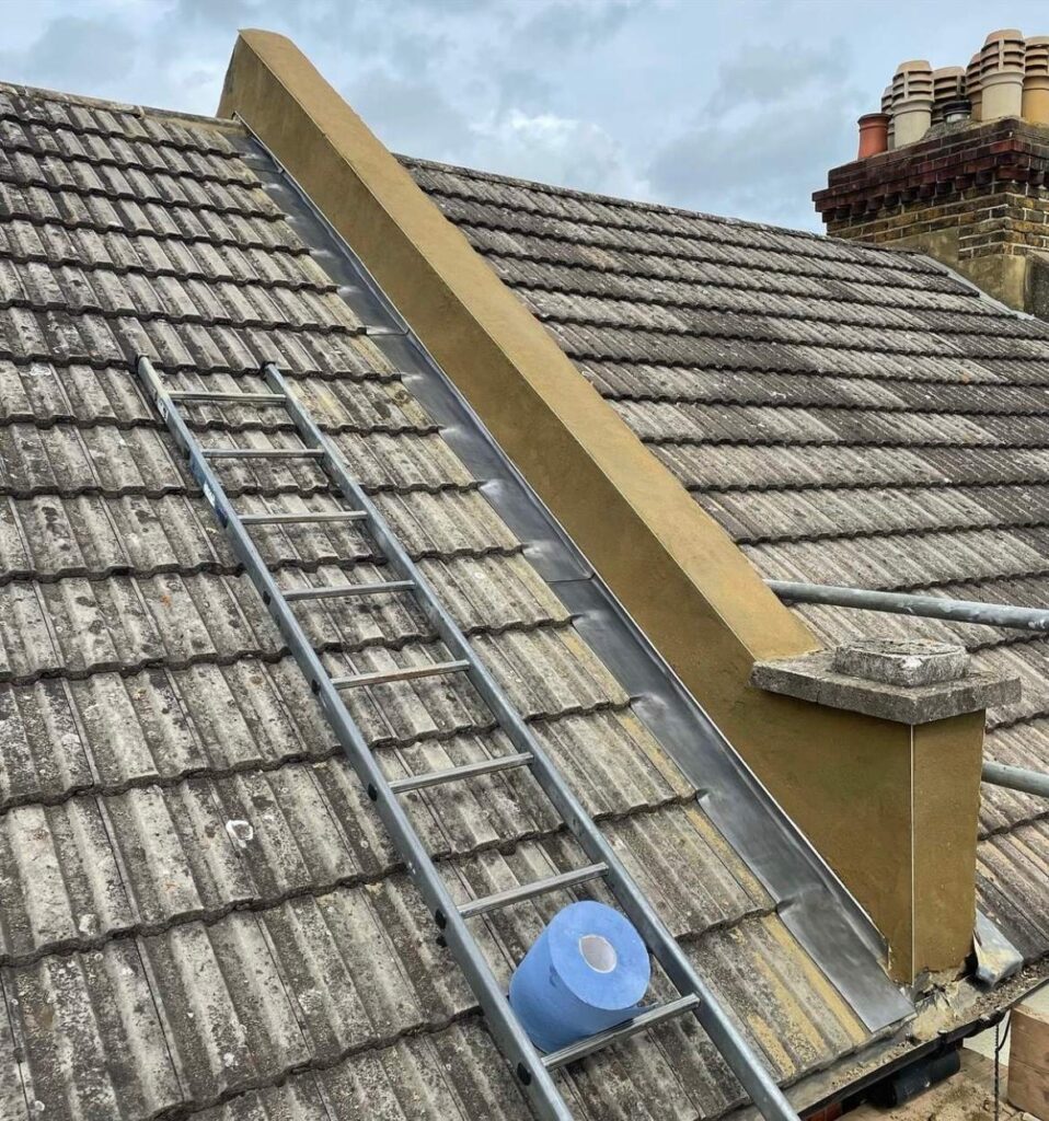 Roof view with ladder and blue tape.